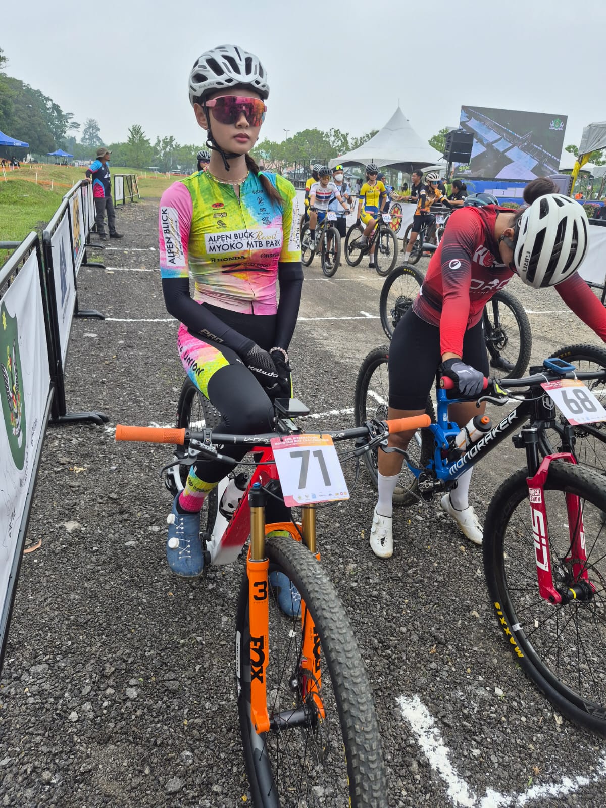 Female mountain bike racer waiting at the start area.